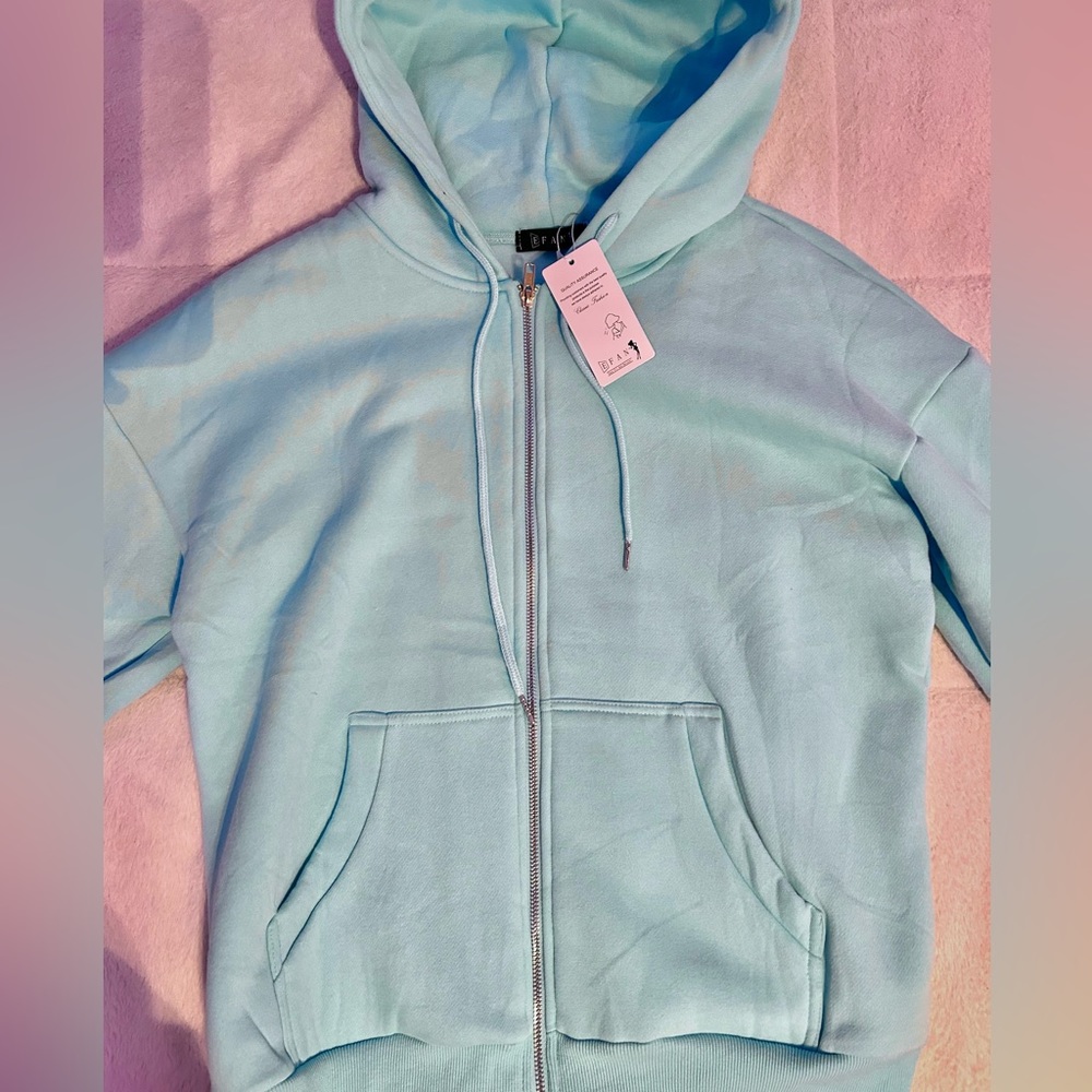 small light blue zip up